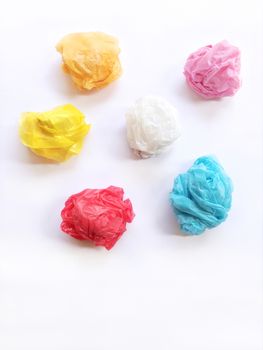 Colorful crumpled plastic bag on white background