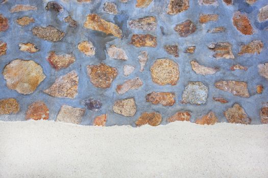 Sand with stones in cement Wall.