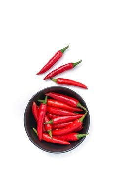 red pepper in a bowl isolated on white background