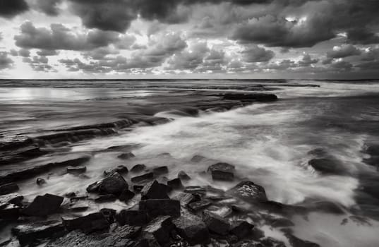 Tidal flows across the rocks at Little Austinmer Beach near Wollongong