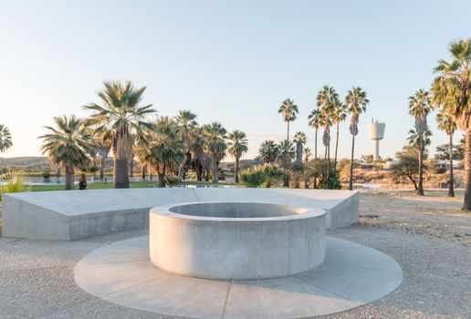 The fountain of the hot springs at Gross Barmen, with a swimming pool and reservoir in the back