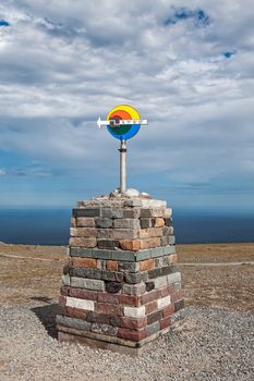 The arrow sign in North Cape in Mageroya island showing the north direction, Norway