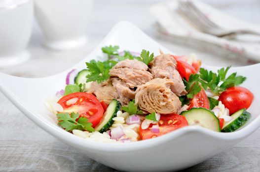   Salad from canned tuna with tomatoes, cucumber and orzo