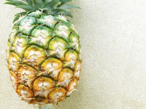 pineapple isolated on plywood background