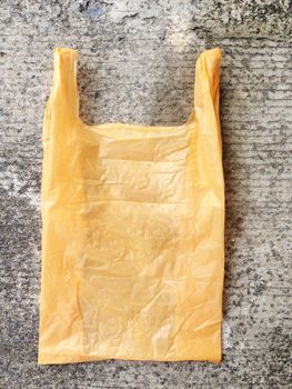 Colorful plastic bag on cement floor