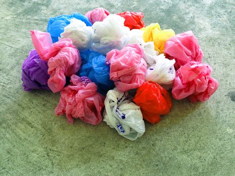 Colorful plastic bag on cement floor