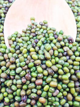 Mung beans and wooden ladle