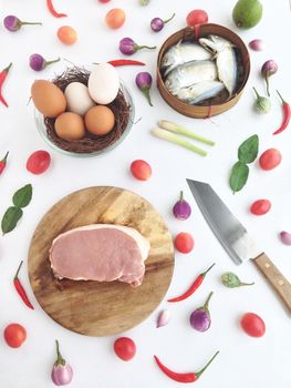 pork on cutting board egg and short mackerel among Vegetable