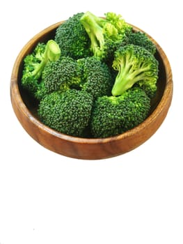 Broccoli in wooden bowl on white background