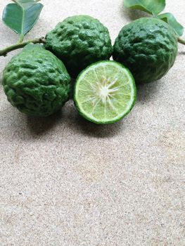 Kaffir Lime or Bergamot on plywood background