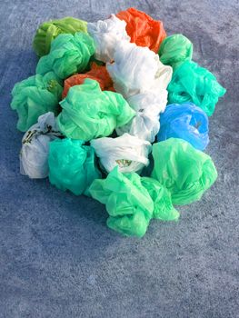 Colorful plastic bag on cement floor