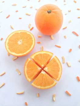 Fresh orange and slices on white background.