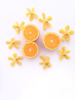 Fresh orange and slices on white background.