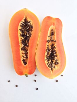 slices of sweet papaya on white background