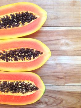 slices of sweet papaya on white background