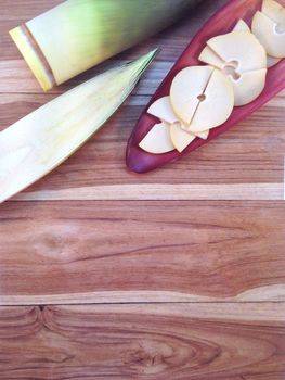 Bamboo shoots and Bamboo shoots slices on banana Blossom on wooden background