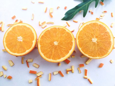 Fresh orange and slices on white background.