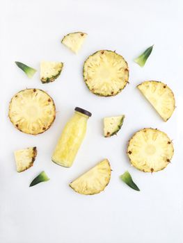 Fresh pineapple drinks and pineapple slices with leaves