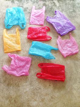 Colorful plastic bag on cement floor