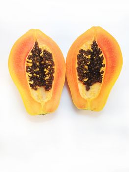 slices of sweet papaya on white background