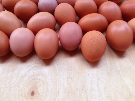 Eggs on wooden plate