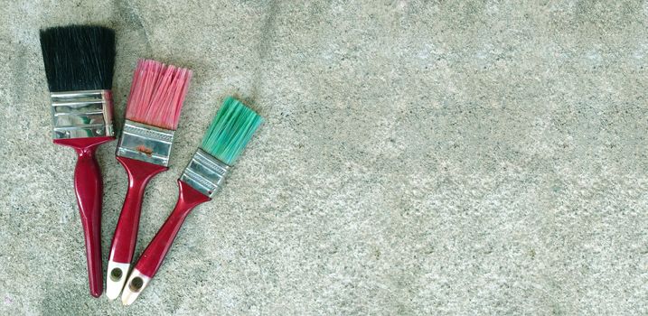 Paint brush on cement floor