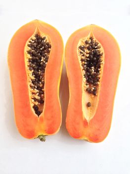 slices of sweet papaya on white background