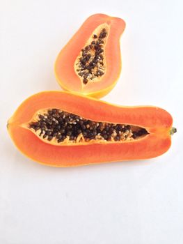 slices of sweet papaya on white background