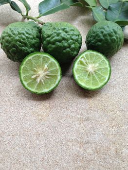 Kaffir Lime or Bergamot on plywood background