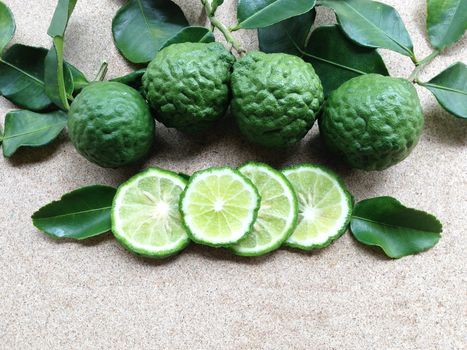 Kaffir Lime or Bergamot on plywood background