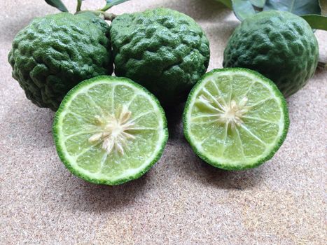 Kaffir Lime or Bergamot on plywood background