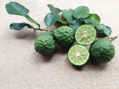 Kaffir Lime or Bergamot on plywood background