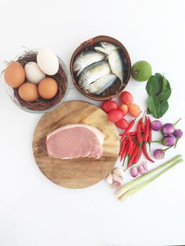pork on cutting board egg and short mackerel among Vegetable