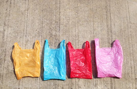 Colorful plastic bag on cement floor