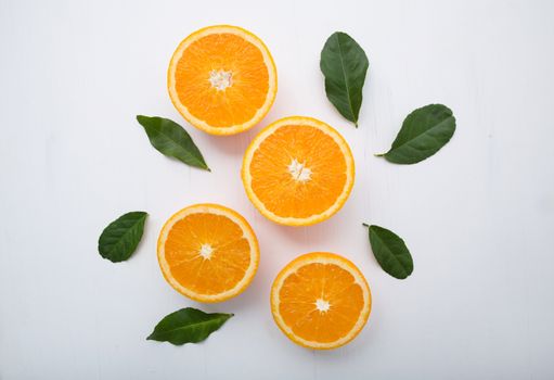 Fresh orange citrus fruit on wooden white background. Top view
