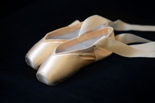 Ballet pointes isolated on a black background