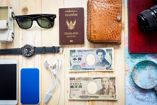 
Top View Of Traveler's Accessories Along For The Trip On Wooden Table, Essential Vacation Items, Travel And Vacations Concept For Background