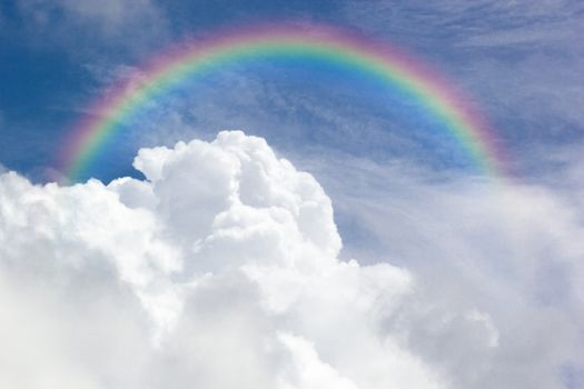 Beautiful Classic Rainbow Across In The Blue Sky After The Rain, Rainbow Is A Natural Phenomenon That Occurs After Rain.
