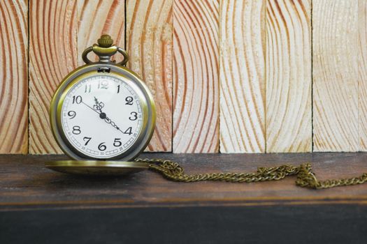 Pocket Watch On Vintage Wood