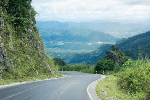 Long And Winding Rural Roads Leading Through Green Hills In Laos, The Route Between Vang Vieng - Luang Prabang