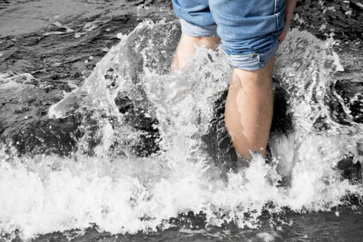 legs in wave sea photo. Beautiful picture, background, wallpaper 
