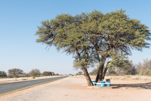 A picnic spot under a camel-thorn tree next to the B1-road near Rehoboth, a town in the Hardap Region of Namibia