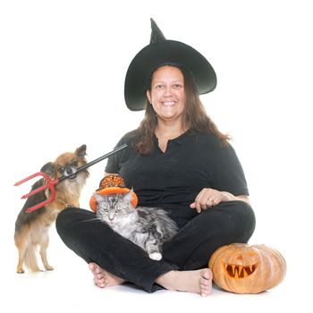 witch and pet in front of white background