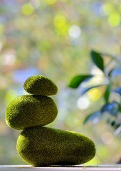 Pyramid from pebbles covered with grass