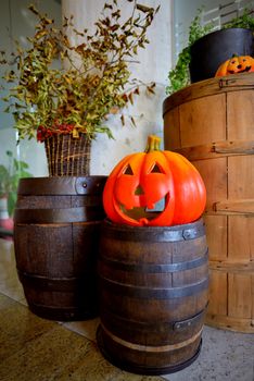 Pumpkins on old barrel inside of house
