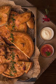 Different pies from meat and vegetables. Freshly baked cakes on a table