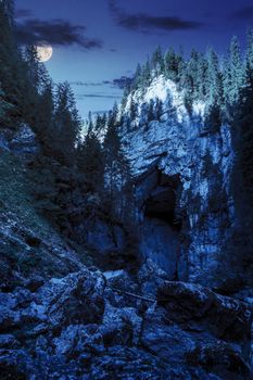 Cetatile cave in romania. Natural citadel sculpted by river in romanian mountains at night in full moon light