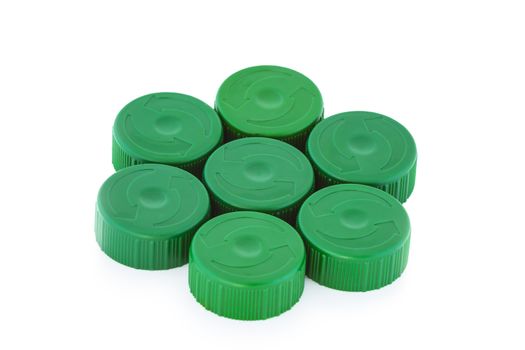 Five green plastic bottle caps isolated on white background