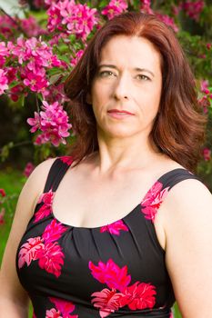 Portrait of a woman in her forties wearing a summer dress