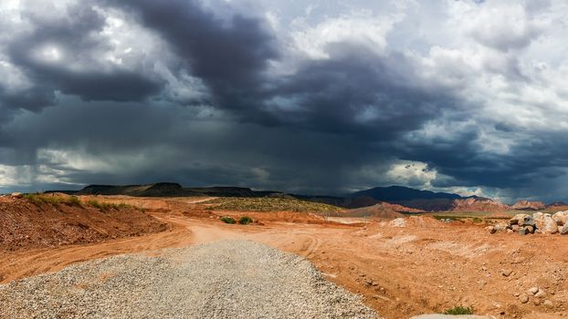 Ominous Stormy Sky and Cumulus Clouds with Rain in the Desert.